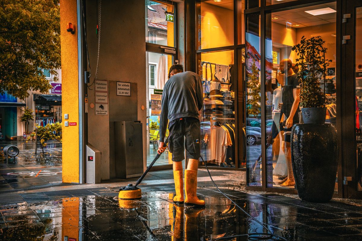 Boonton, NJ Office Cleaning Services Cleaner washing a storefront entrance in Boonton, NJ