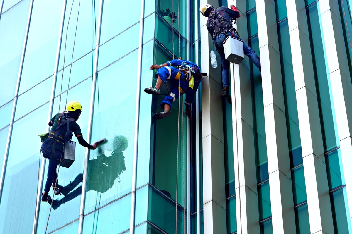 Commercial window and office cleaning crew at work on a glass office building in Morristown, NJ